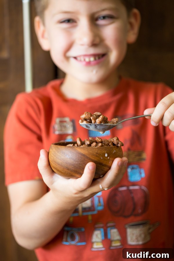 Southwestern-Style Mac and Cheese Cup Recipes for Game Day 4 Little boy holding a small bowl of Annie's Cocoa Bunnies and milk.