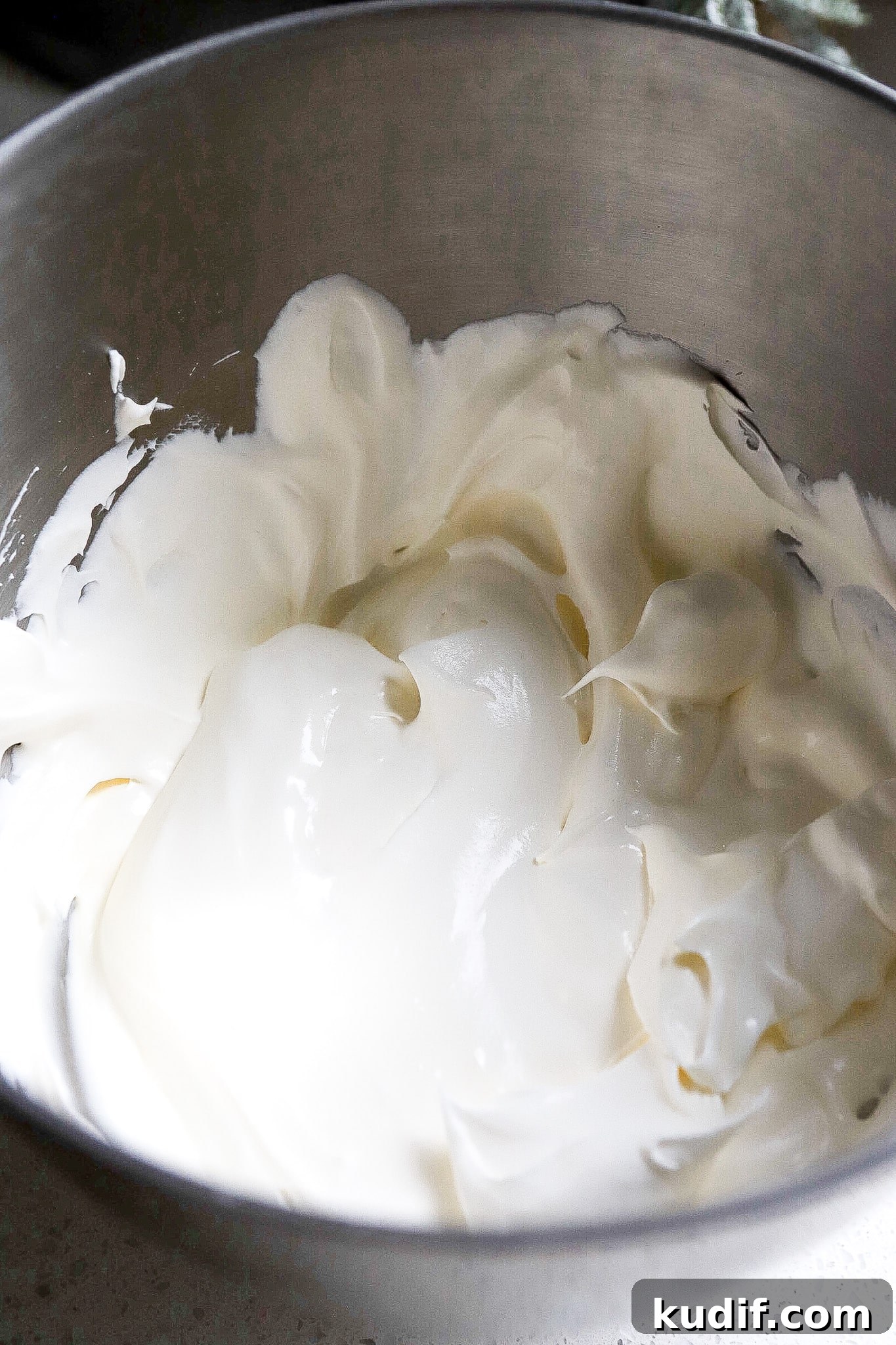 Peppermint Dessert Dip for Christmas Parties 4 Close up view of Christmas peppermint cheesecake dip in mixing bowl.