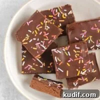 Chocolate protein with sprinkles laid out on a white plate.