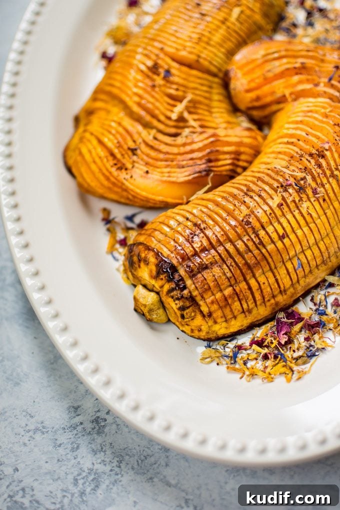 Honey-Cinnamon Roasted Hasselback Butternut Squash Recipe 5 close-up of vegetarian honey hasselback butternut squash on a plate