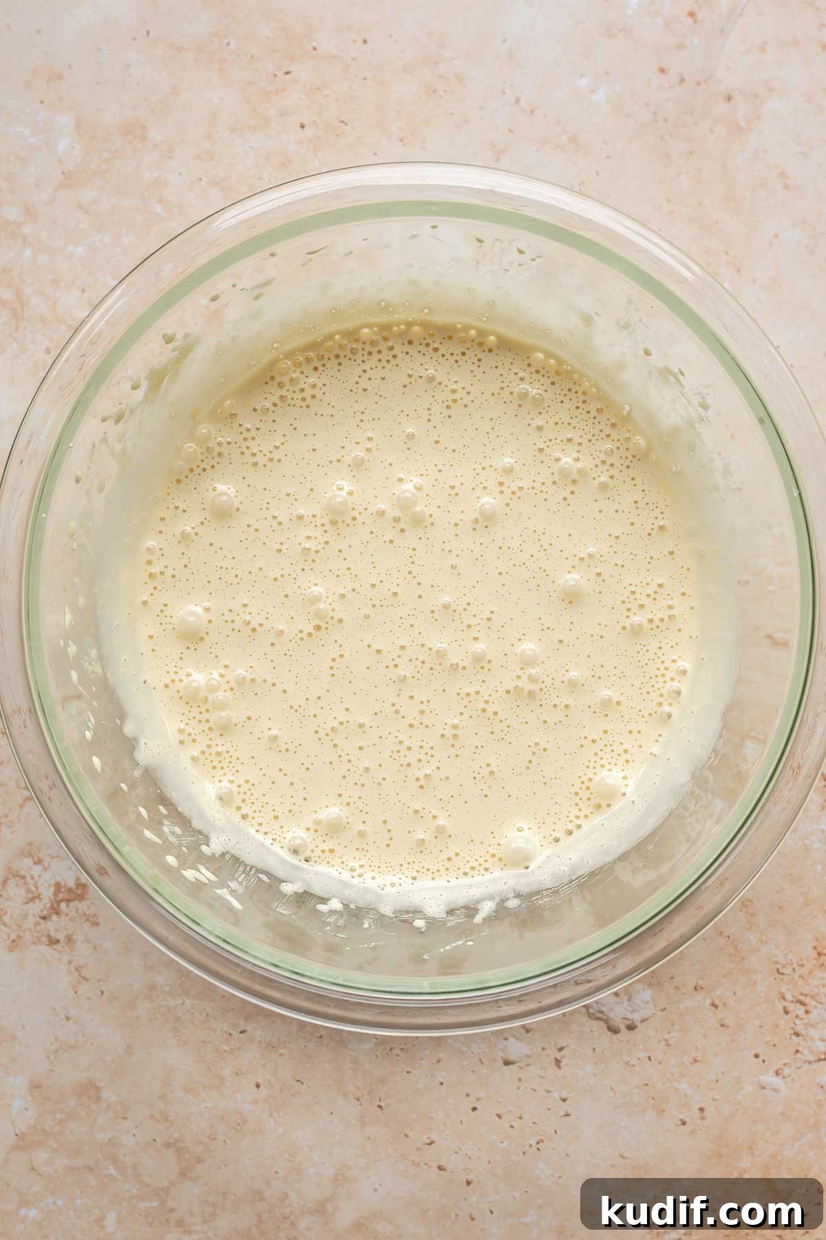 Coconut Tres Leches Cake Recipe — Moist Latin-Style Dessert 7 Sponge cake batter in a bowl.