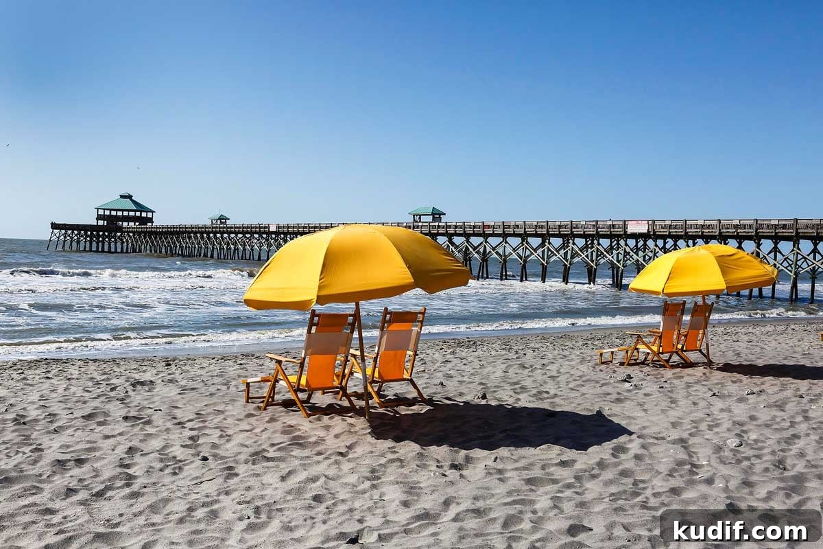 Top Beaches Near Charleston, South Carolina You Should Visit 2 Empty beach chairs on the sand near Folly Beach pier outside Charleston, South Carolina seem to invite vacationers to come and relax.