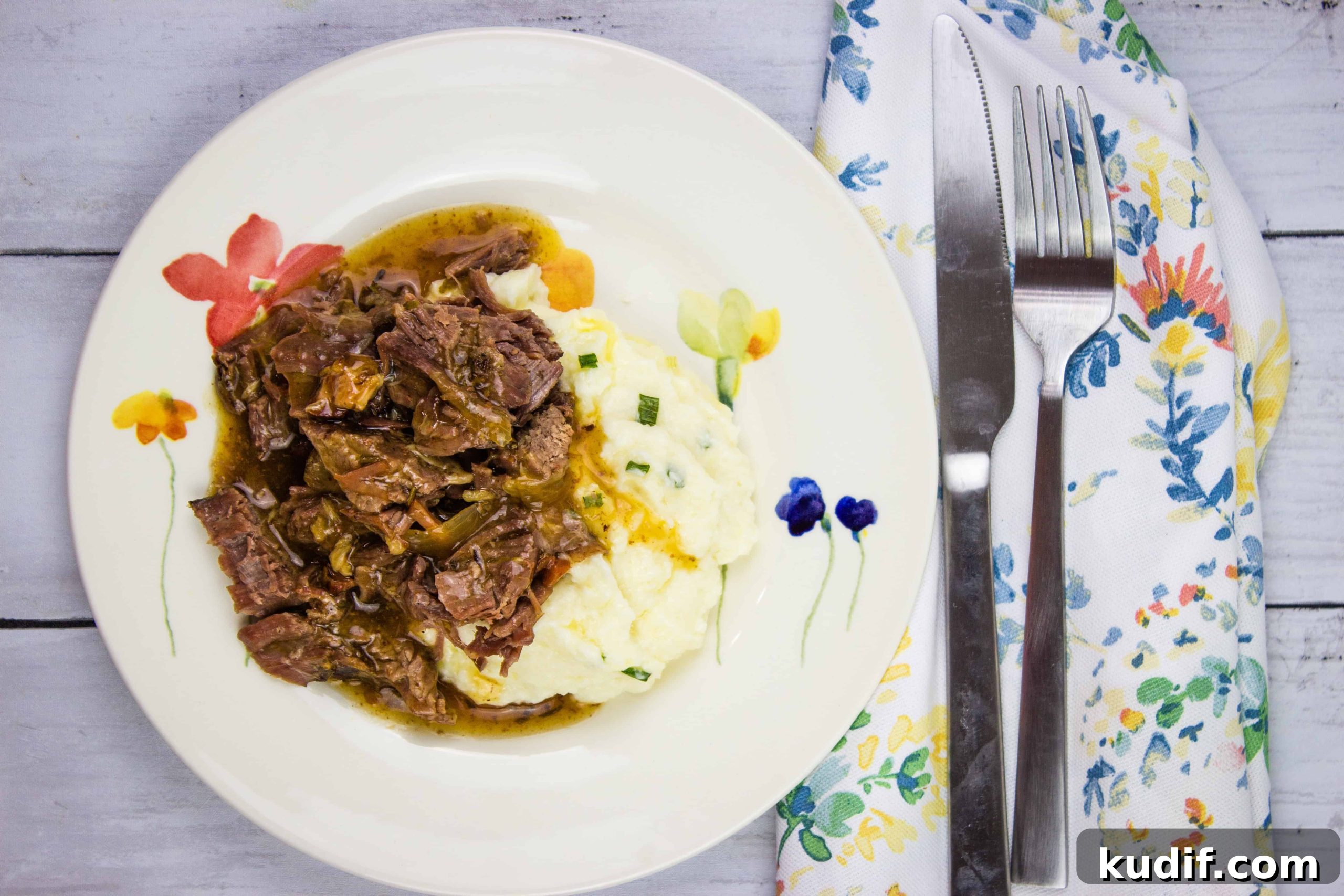 31 Delicious Recipes That Deliver Big Flavor with Little Effort 15 A plate of pot roast with bacon and mashed potatoes with gravy.