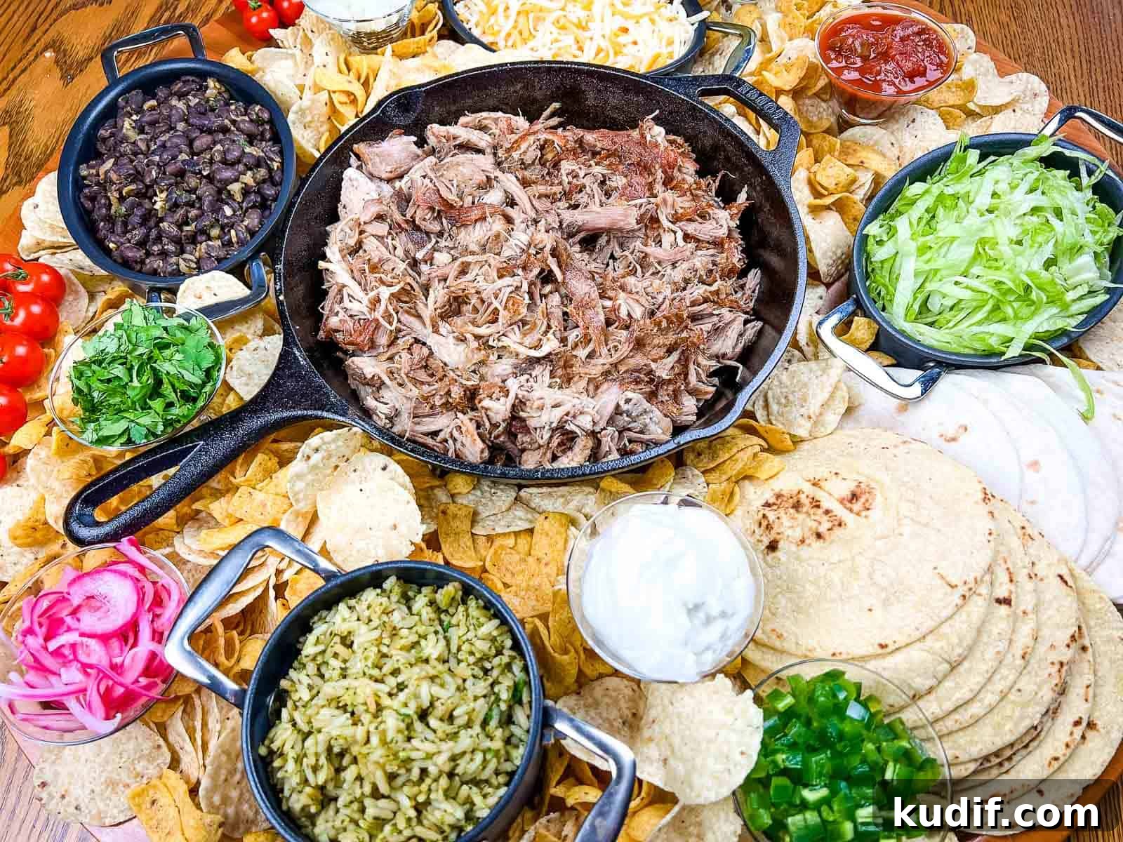 31 Delicious Recipes That Deliver Big Flavor with Little Effort 20 A platter of pork carnitas board on a wooden table.