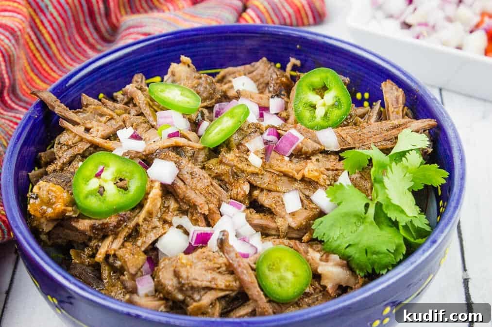 31 Delicious Recipes That Deliver Big Flavor with Little Effort 21 Beef Barbacoa in a blue bowl.