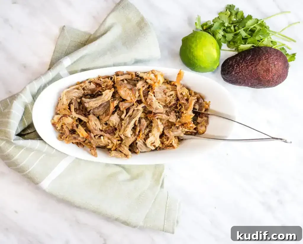 31 Delicious Recipes That Deliver Big Flavor with Little Effort 23 Al Pastor Carnitas in a white bowl with tongs.