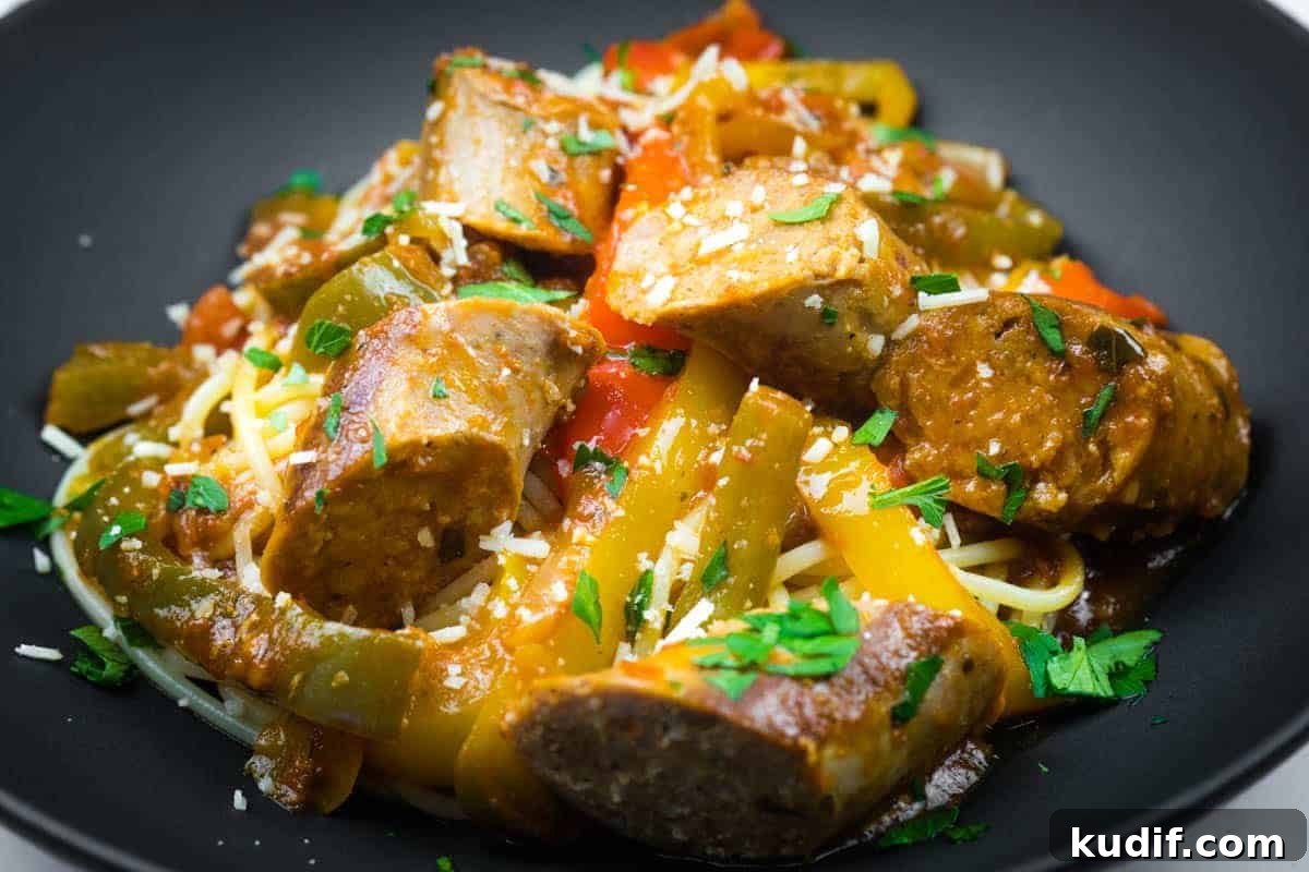 31 Delicious Recipes That Deliver Big Flavor with Little Effort 7 Slow cooker sausage and peppers garnished with grated cheese and chopped parsley.