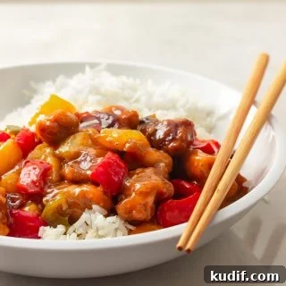 Sweet and Sour Chicken Recipe That Beats Takeout 7 A bowl of sweet and sour chicken over rice