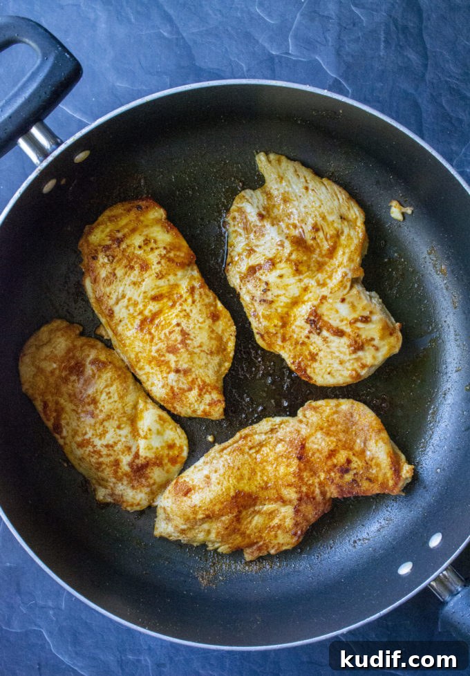 Cheesy Jalapeño Keto Chicken Skillet Recipe 5 seared chicken in a pan