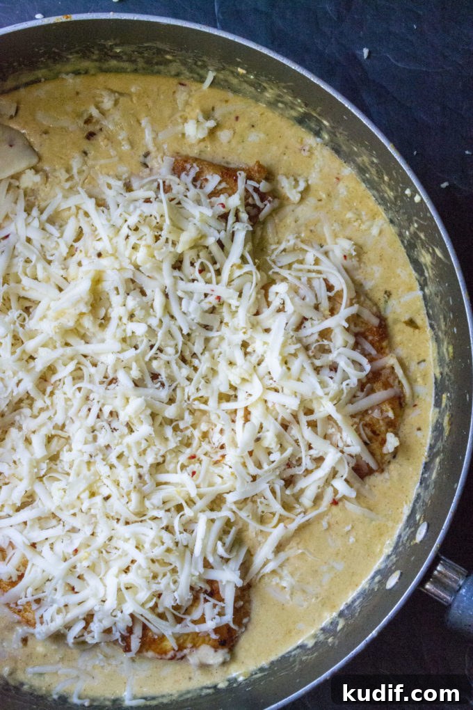 Cheesy Jalapeño Keto Chicken Skillet Recipe 8 cheese covered chicken
