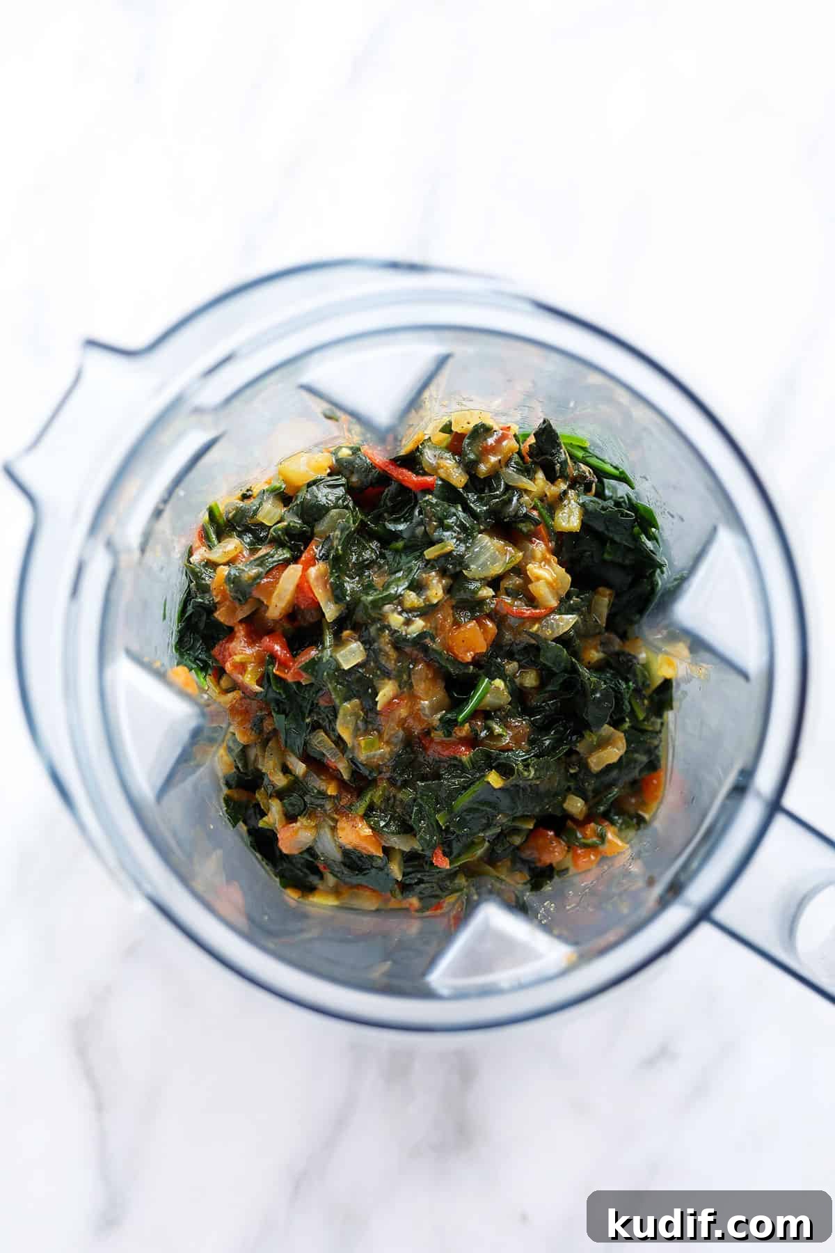 Ingredients for palak paneer in a blender. 