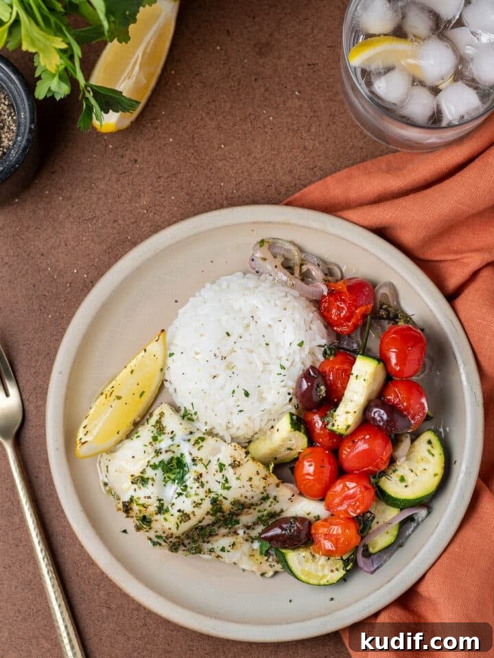 Mediterranean Sheet-Pan Baked Cod with Parsley Garlic Oil 11 plate with rice, cod and veggies