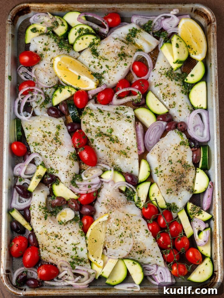 Mediterranean Sheet-Pan Baked Cod with Parsley Garlic Oil 9 unbaked cod and veggies on sheet pan