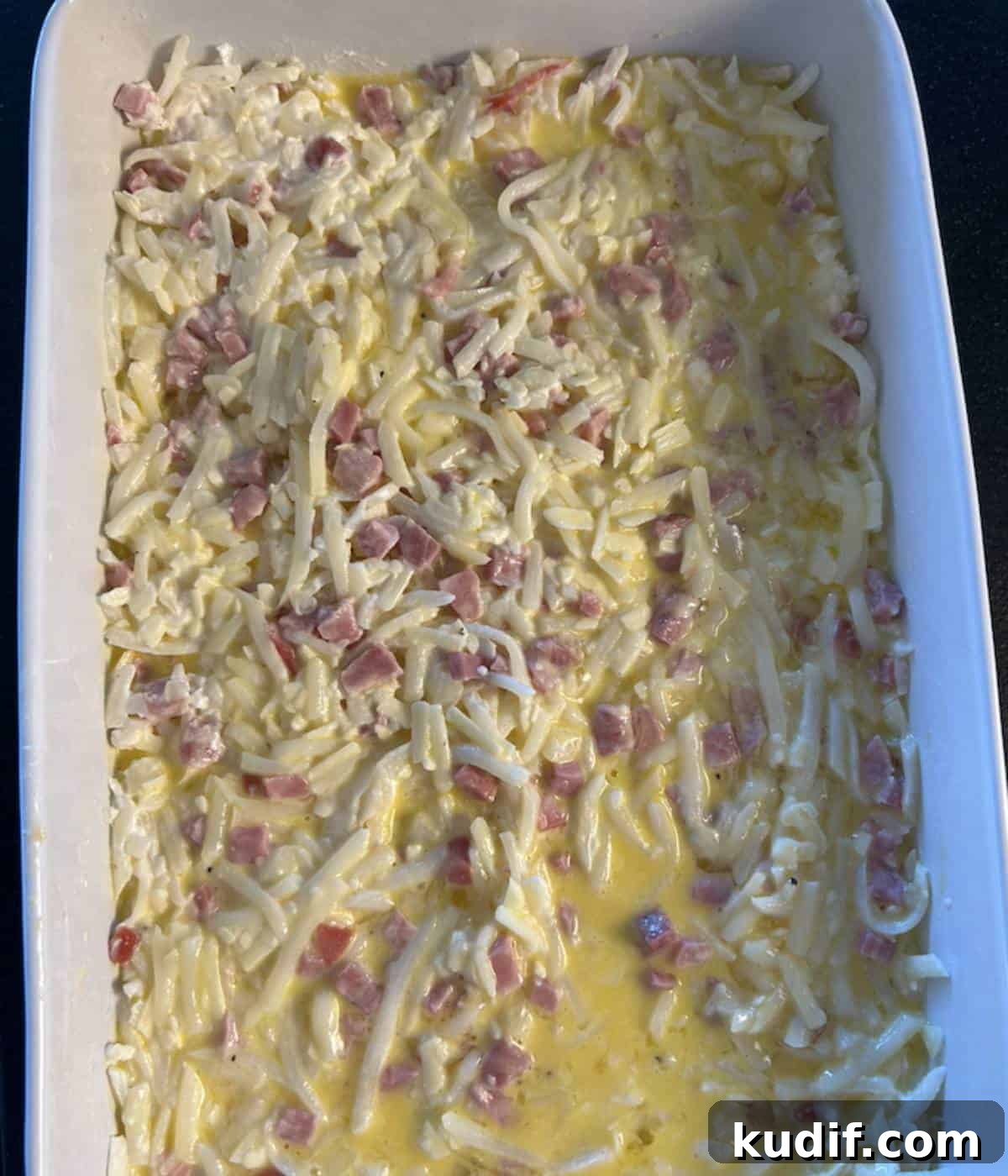 Cheesy Ham, Egg & Hashbrown Breakfast Casserole Recipe 6 Ham Casserole with Eggs poured over top.