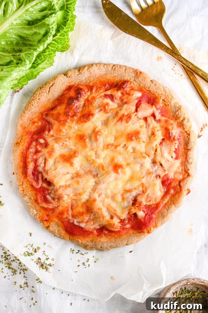 High-Protein Pizza Recipe for Muscle Gain and Recovery 12 High protein pizza baked until melting cheesy and golden brown, ready to be sliced and served.