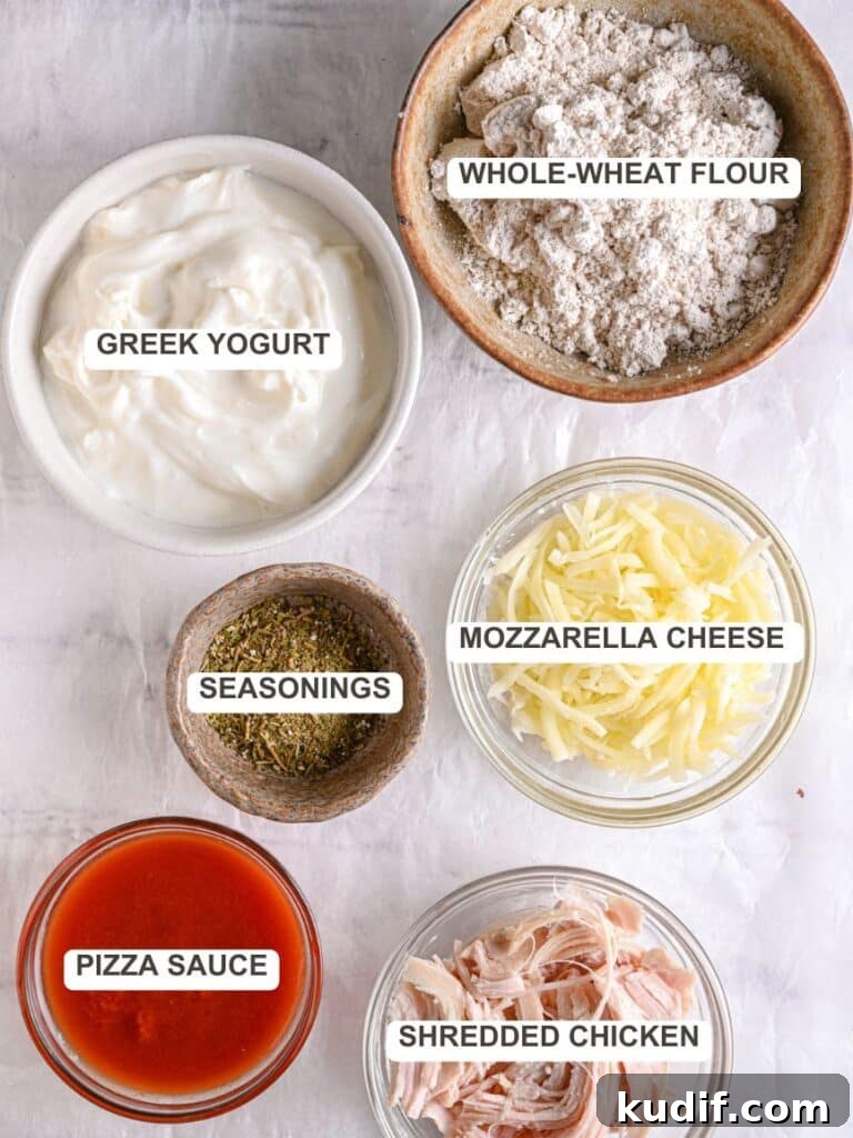 High-Protein Pizza Recipe for Muscle Gain and Recovery 3 Homemade protein Pizza Ingredients - Wholewheat flour, Greek yogurt, seasonings, shredded mozzarella cheese, pizza sauce, shredded chicken