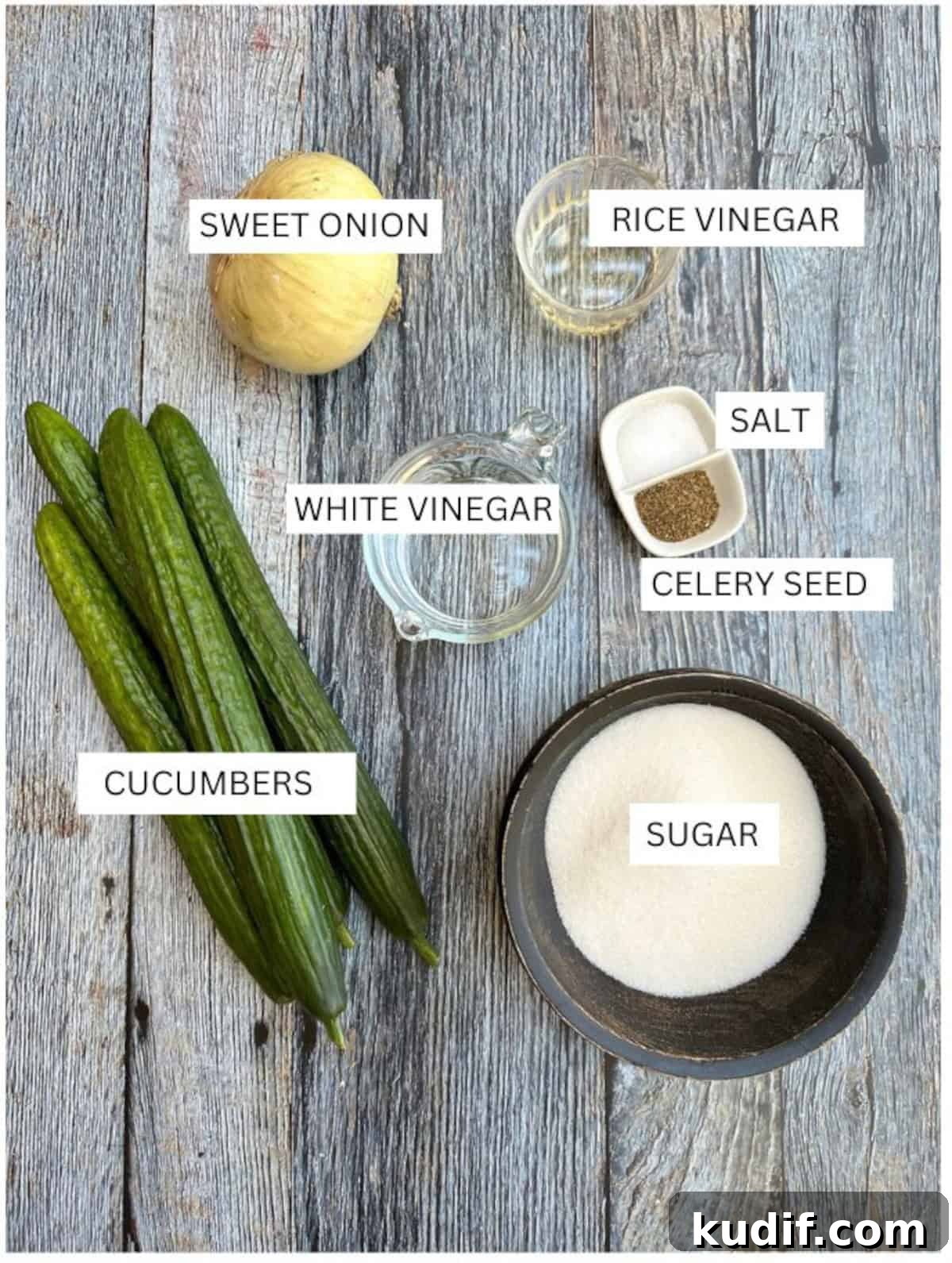 Crisp Quick Pickled Cucumbers Recipe for Homemade Snacks 4 Labeled ingredients for refrigerator pickles on a wooden table.
