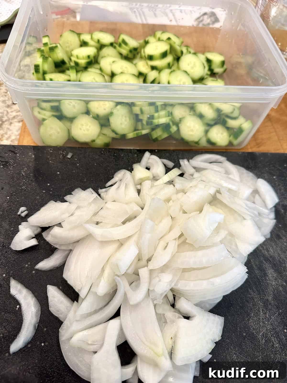 Crisp Quick Pickled Cucumbers Recipe for Homemade Snacks 6 Sliced onions and cucumbers for refrigerator pickles.