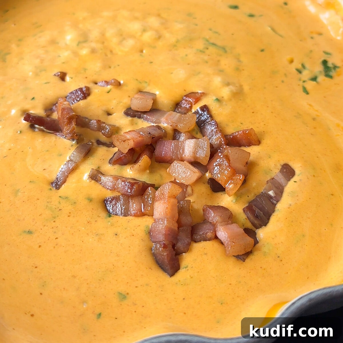 Add the bacon back in along with our cheeses!