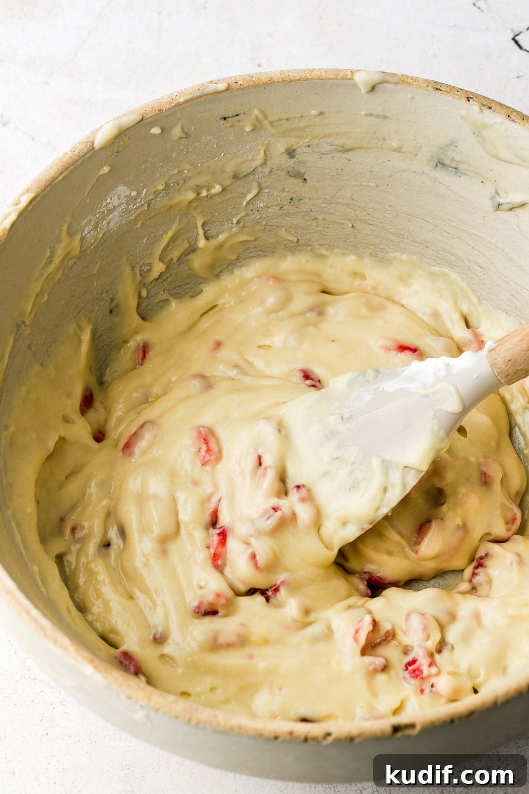 Strawberry Muffins with Crunchy Strawberry Crumble Topping 10 fold strawberries into batter