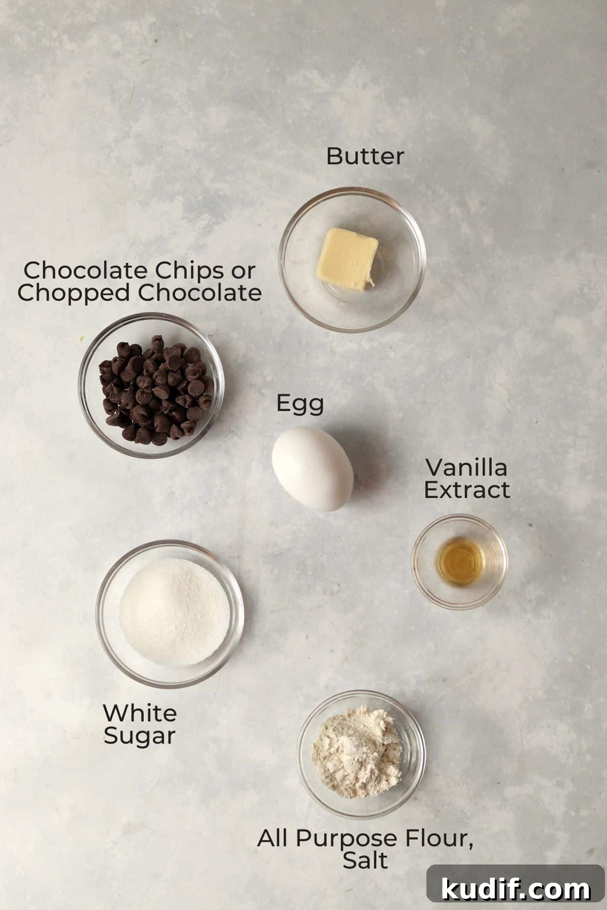 Ingredients to make a single serve molten lava cake in small glass prep bowls.