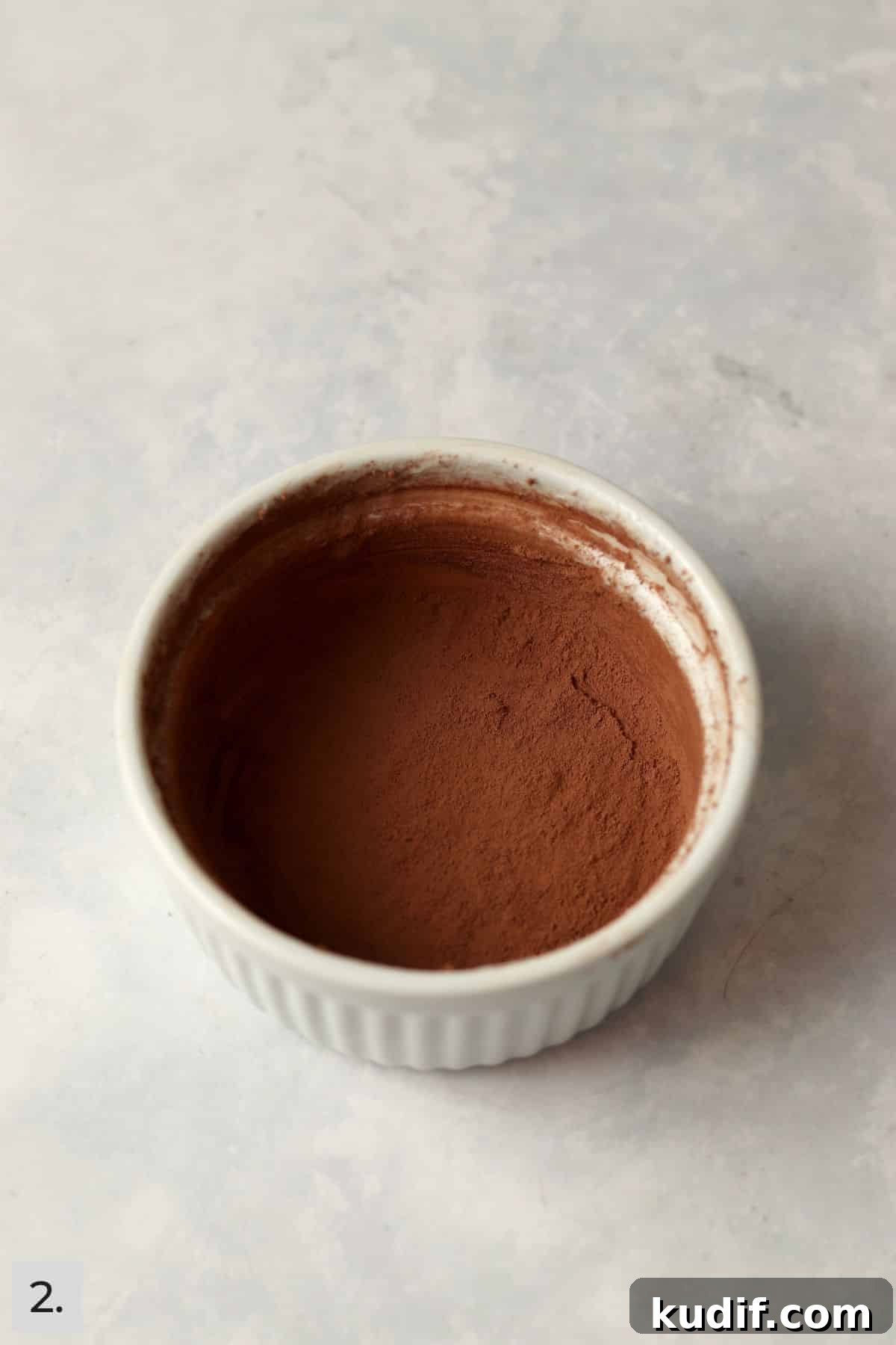 Ramekin greased with butter and dusted with cocoa powder.