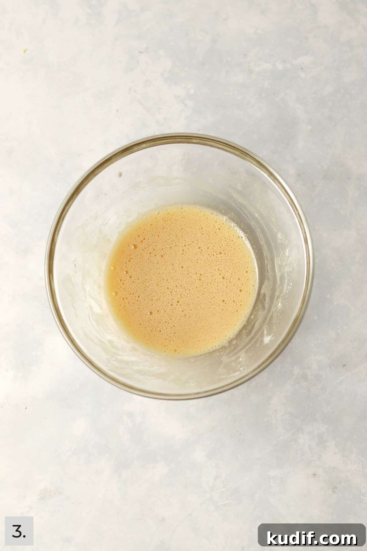 Sugar, egg, and vanilla whisked in a mixing bowl until foamy.