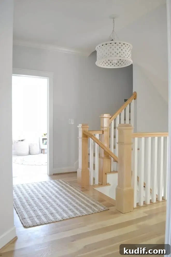 a hallway with wood trim and Sherwin Williams ice cube paint