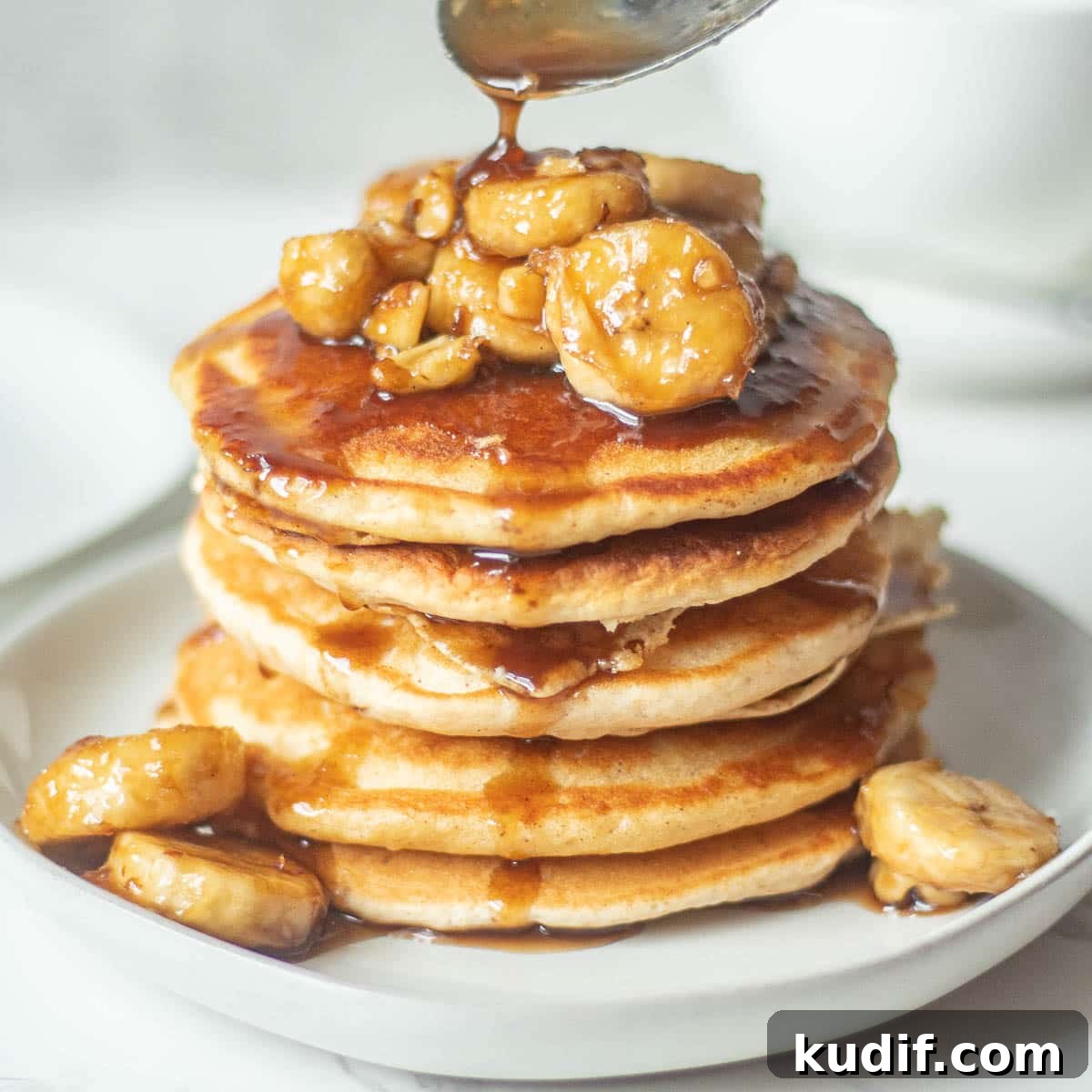 Bananas Foster Pancakes with Rum-Butter Sauce Recipe 2 stack of bananas foster pancakes