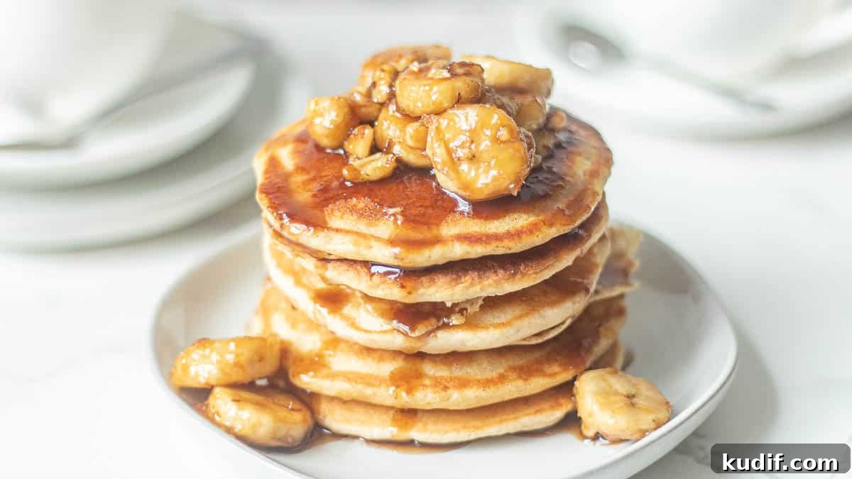 Bananas Foster Pancakes with Rum-Butter Sauce Recipe 5 bananas foster pancakes recipe stacked on a plate