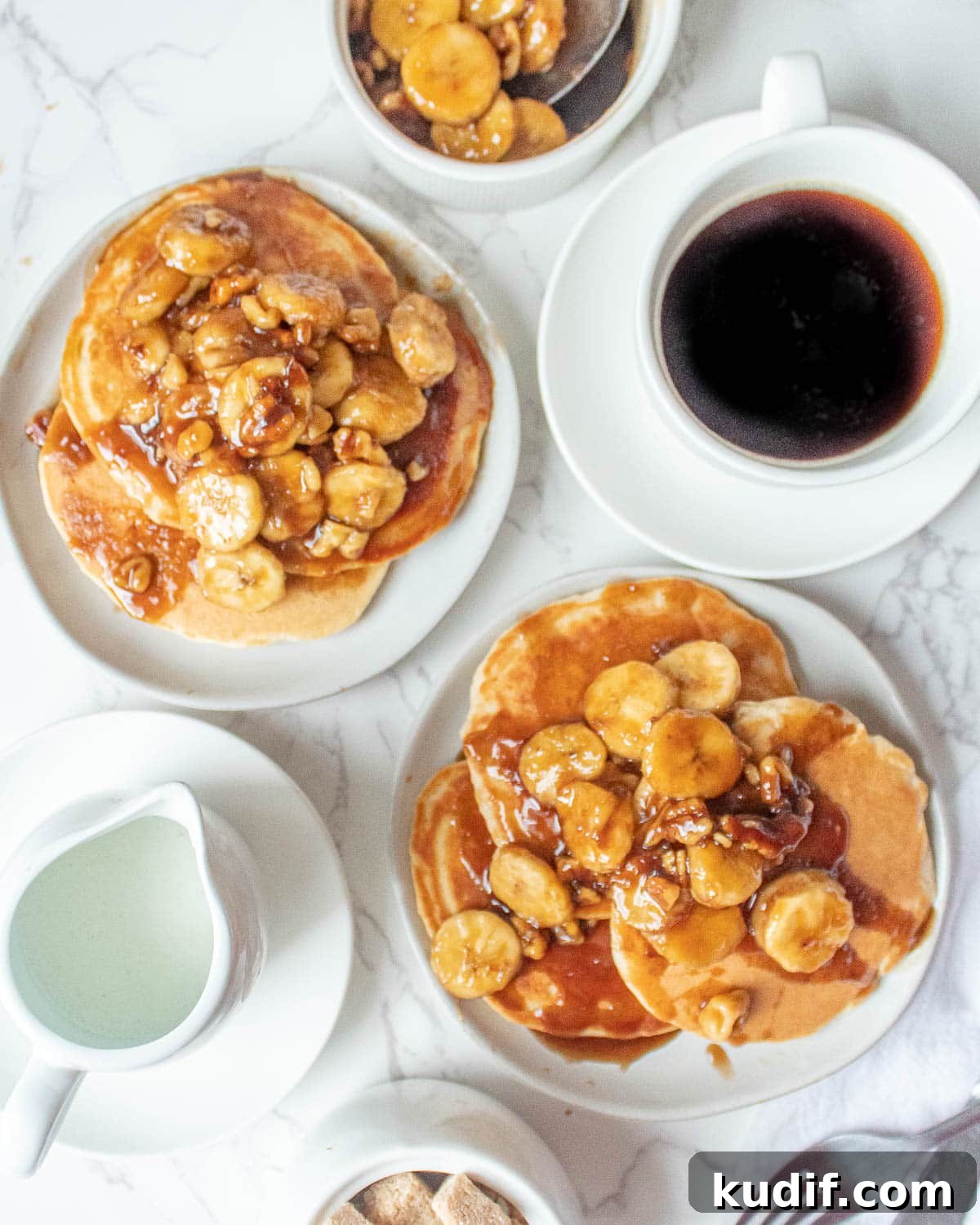 Bananas Foster Pancakes with Rum-Butter Sauce Recipe 6 banana foster pancakes without alcohol stacked on a plate