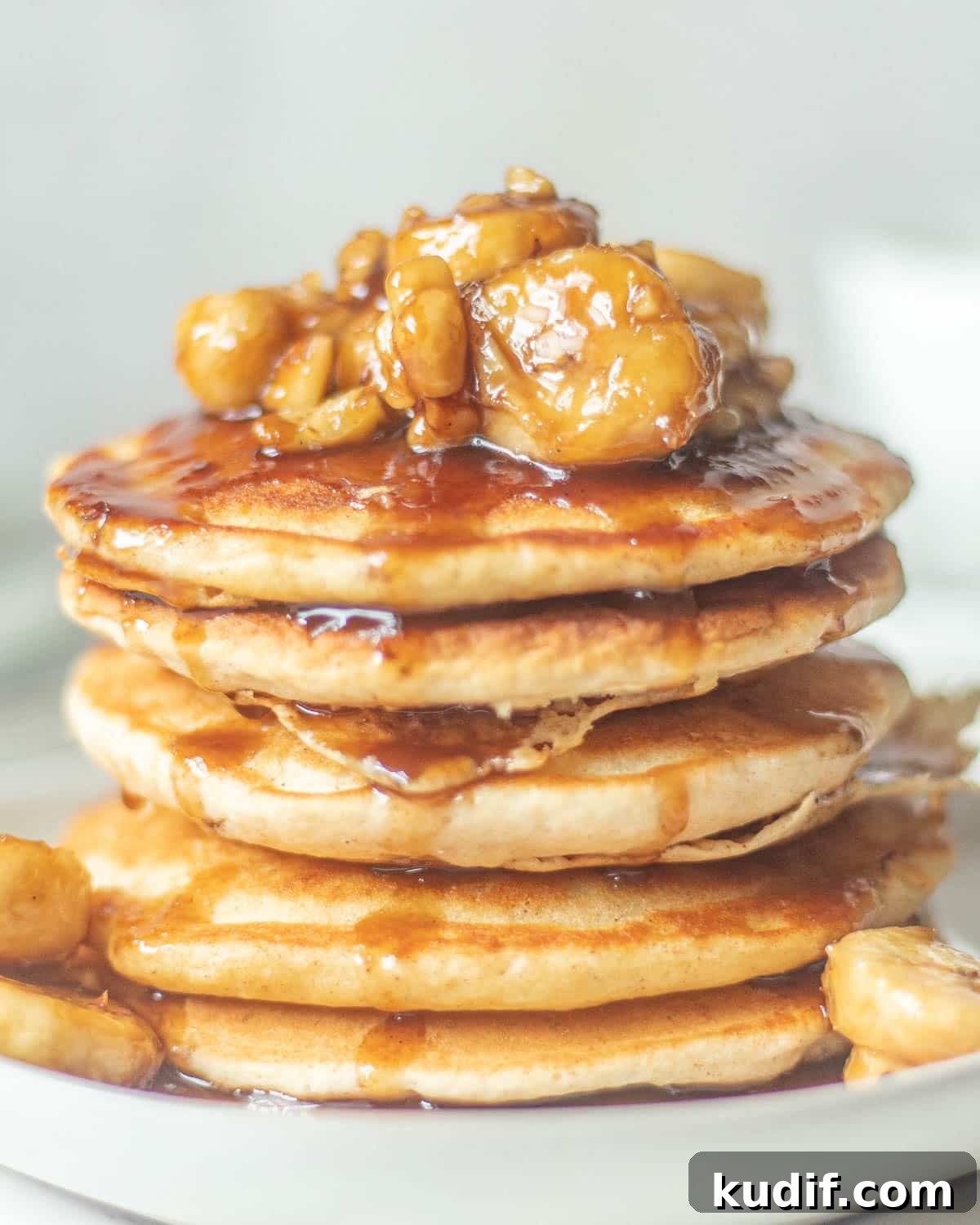 Bananas Foster Pancakes with Rum-Butter Sauce Recipe 7 banana topping for pancakes in a stack