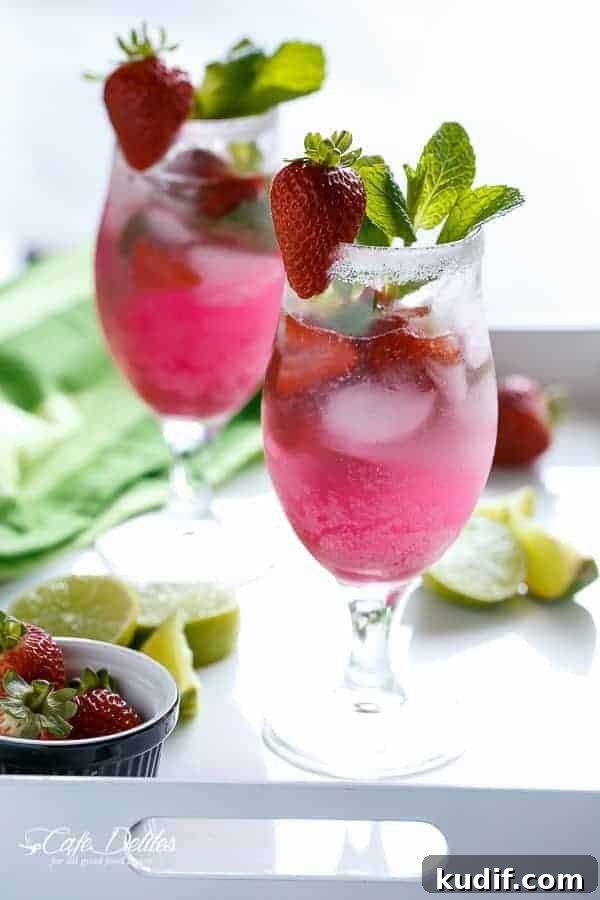 Strawberry Coconut Mojito Recipe – Refreshing Summer Cocktail 2 Strawberry Coconut Mojitos in a glass
