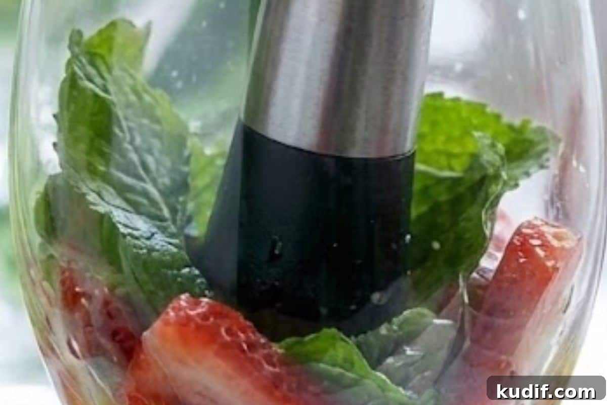 Strawberry Coconut Mojito Recipe – Refreshing Summer Cocktail 7 Divide mint leaves and sliced strawberries between four glasses, juice one lime and add about a teaspoon to each, then gently muddle