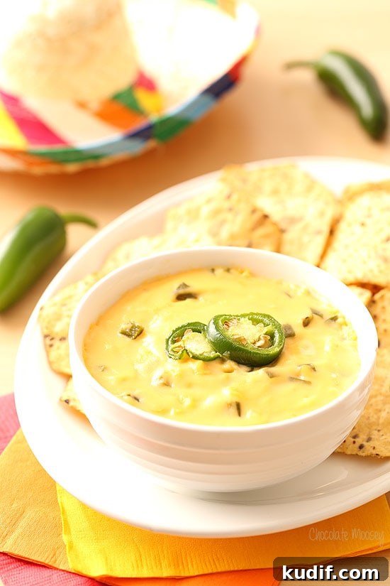 Homemade Queso: Creamy Nacho Cheese Dip Recipe 4 Queso in white bowl