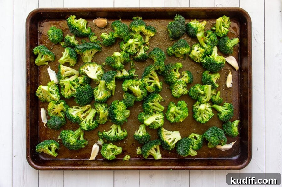 Crispy Garlic-Roasted Broccoli Recipe for Flavorful Sides 4 garlic and broccoli on a sheet pan