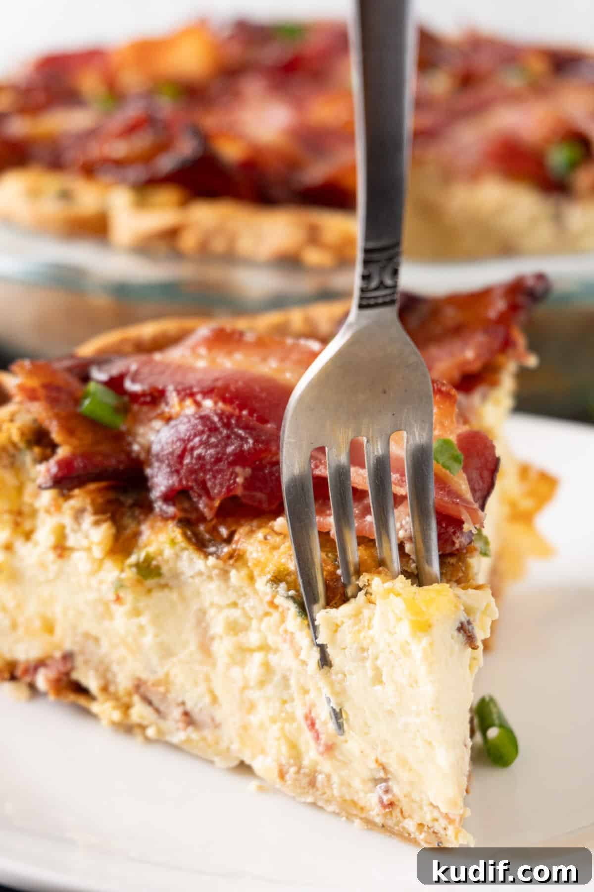 fork taking a piece out of slice of pie