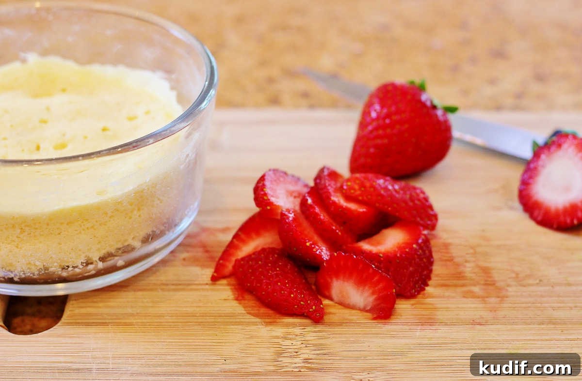 Paleo Strawberry Lemon Shortcake Recipe: Light, Grain-Free Dessert 3 Chopping the berries and cooking the shortcake.