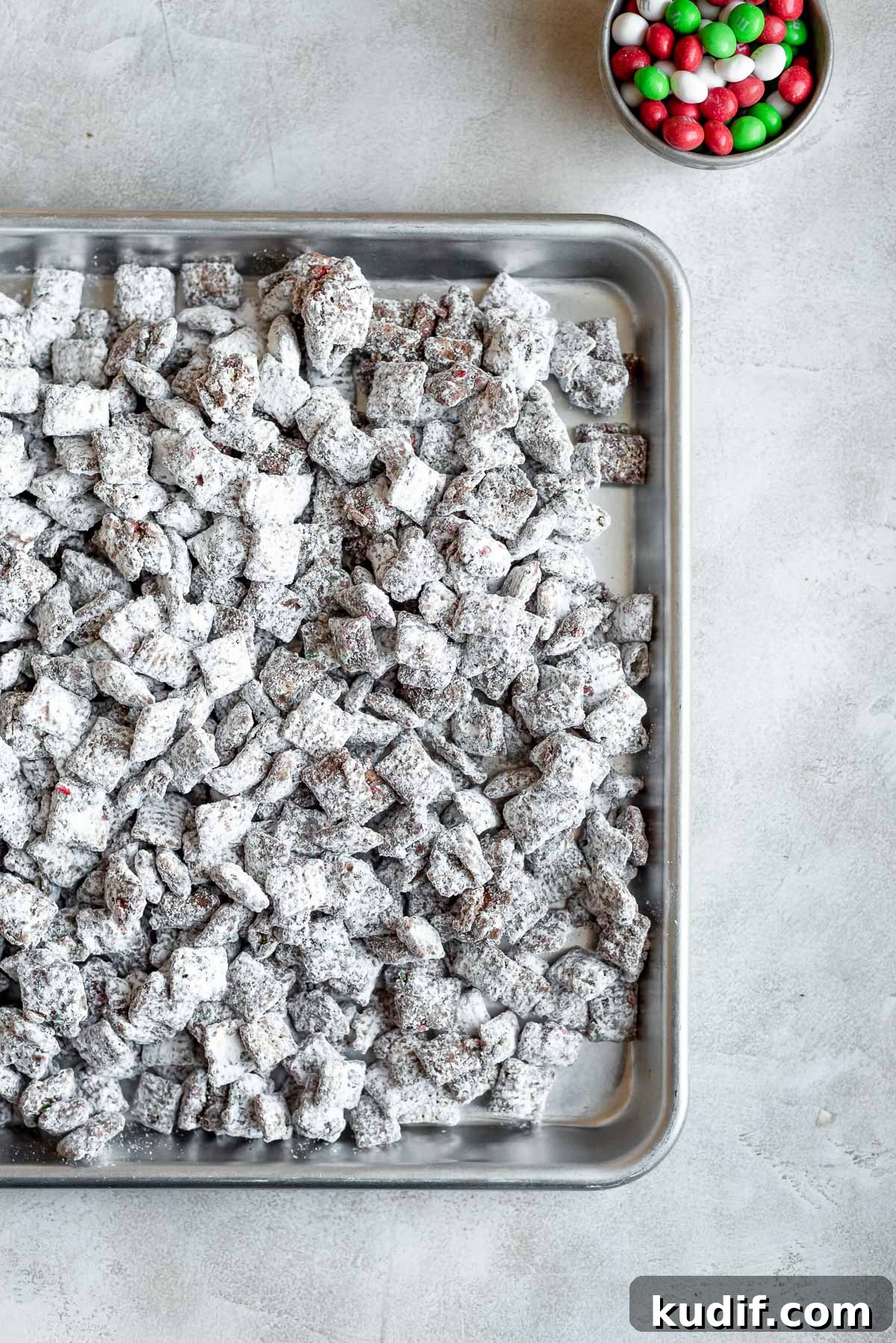 Festive Christmas Puppy Chow Snack Mix Recipe 6 christmas puppy chow on baking sheet