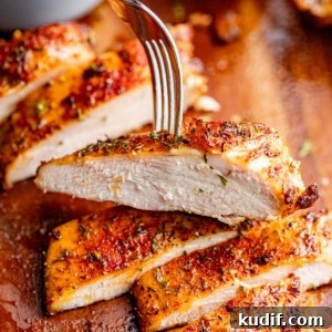 a piece of sliced chicken breast on a fork.