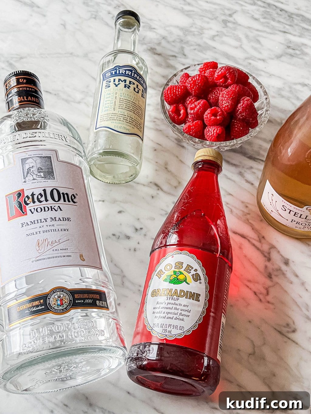 Raspberry Vodka Champagne Cocktail Recipe for Celebrations 4 vodka, simple syrup, grenadine, raspberries, champagne