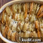 Hasselback Potato Gratin. Slices of Yukon gold potatoes and sweet potatoes, topped with a delicious and light cheesy cream sauce.