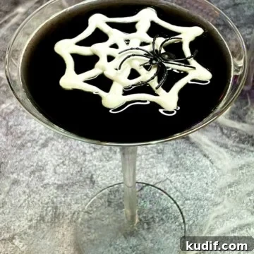 Black Martini Cocktail Recipe and Serving Guide 13 black martini with a meringue web and a toy spider