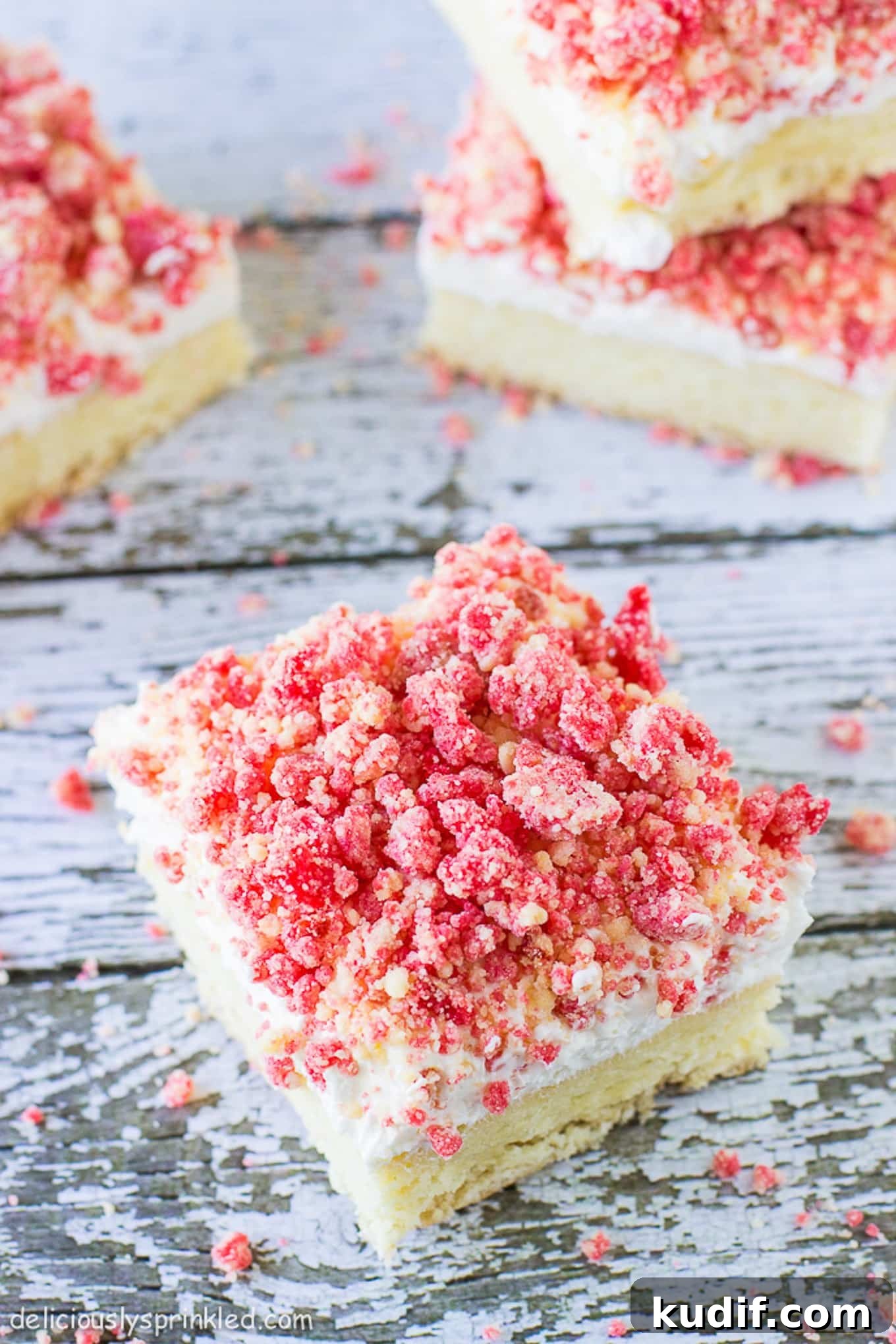 Cut squares of strawberry shortcake bars. 