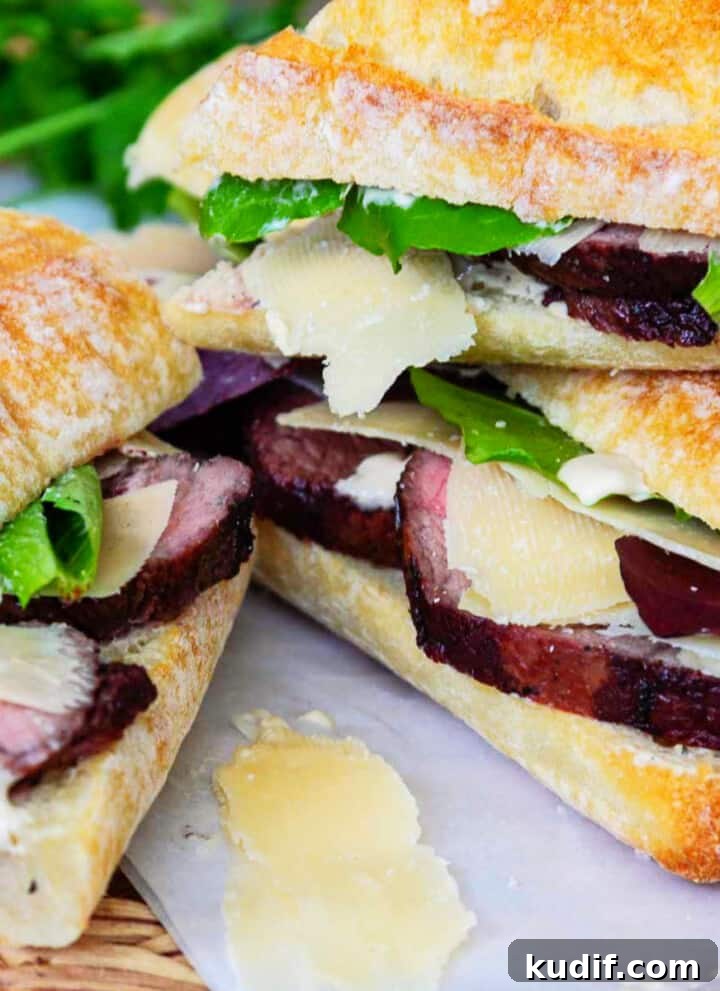 Thick sliced roast beef on baguettes with lettuce, horseradish sauce, and shaved parmesan.