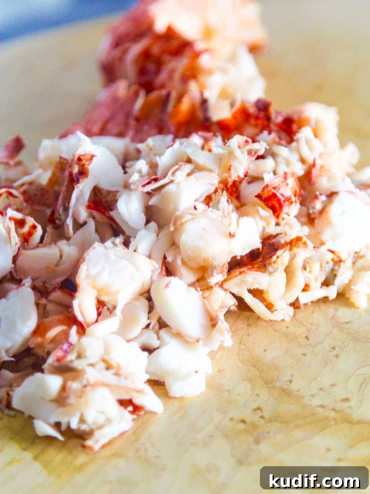 Lobster BLT Sandwich with Crispy Bacon and Lemon Aioli 10 Cooked lobster meat on a cutting board ready to use in a recipe.