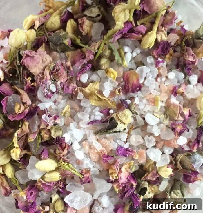 Make-Your-Own Floral Bath Salts: DIY Recipe & Scent Ideas 4 DIY floral bath salts -- rose and jasmine dried flower buds close up.