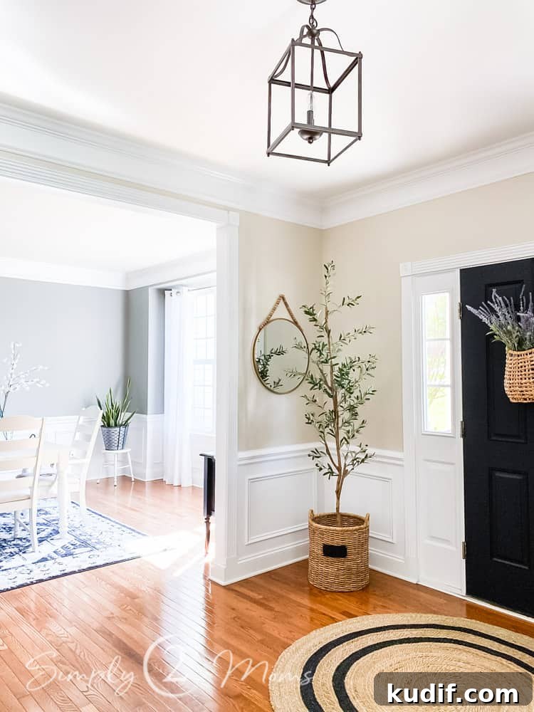 tall faux olive tree in floor wicker basket in corner next to front door