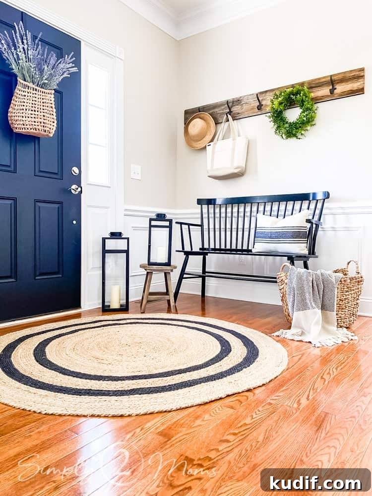 round entryway sisal rug by front door and bench with foyer decor