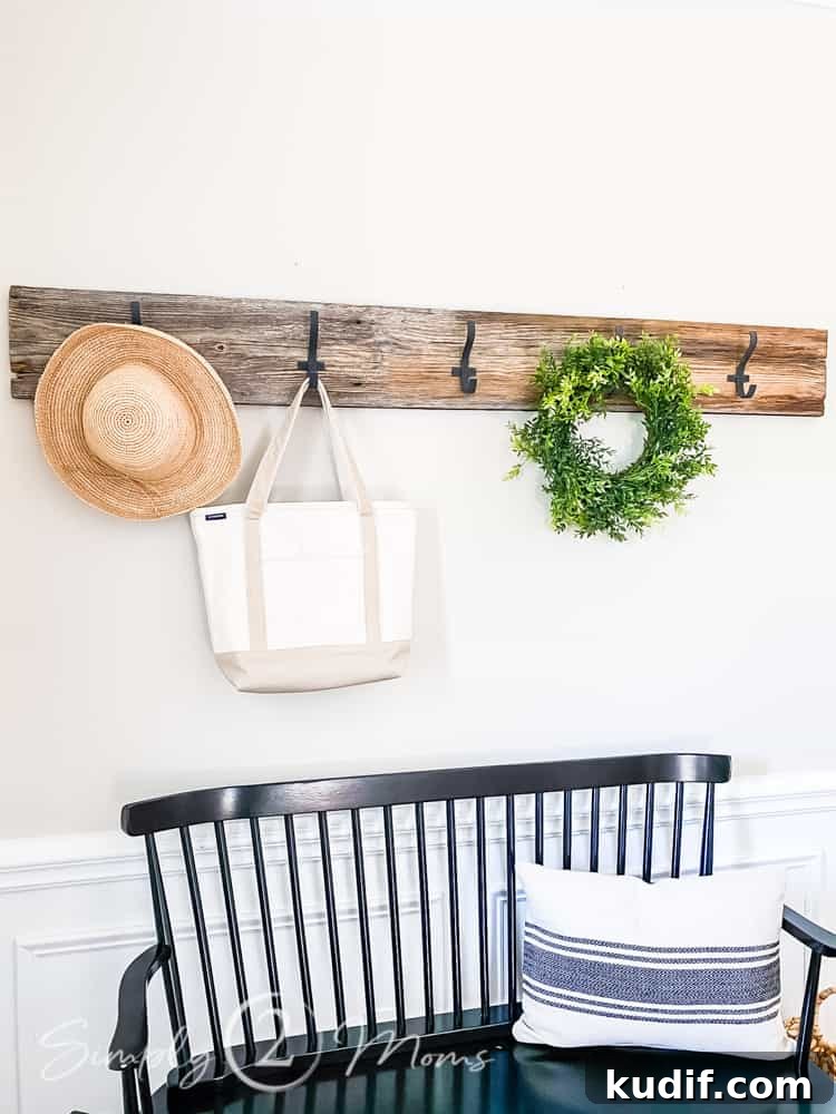 diy barn wood row of hooks with hat, back and wreath hanging from hooks